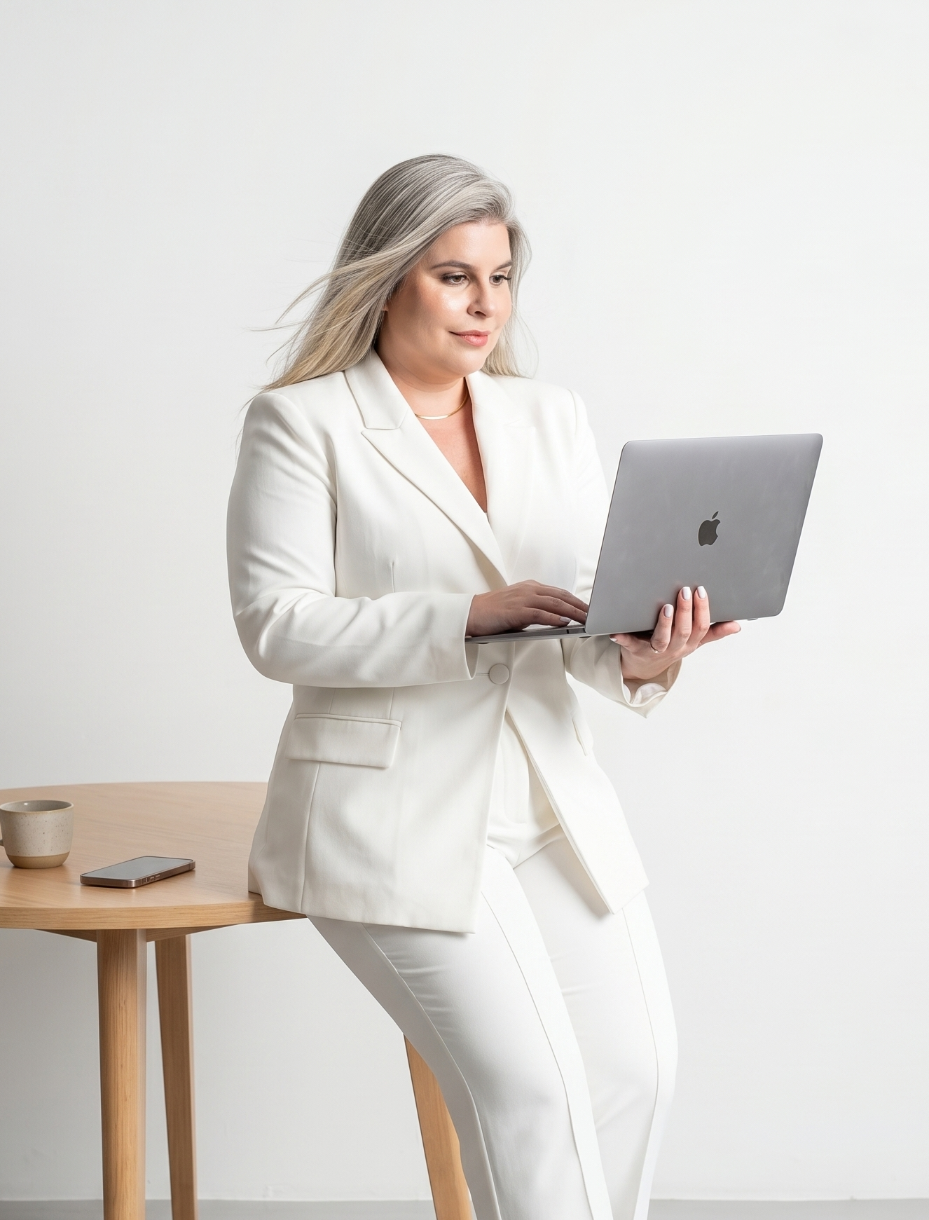 Aline Rivieri working on a laptop